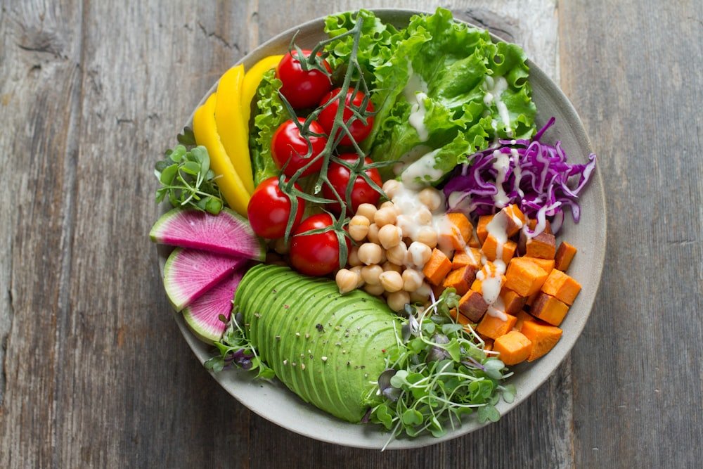 A build-your-own bowl loaded with fresh vegetables, chickpeas and avocado