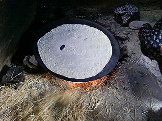 Saj bread baking on the dome